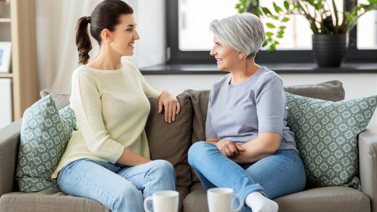 younger woman talking to an older woman