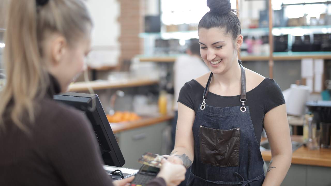 woman paying with a gift card