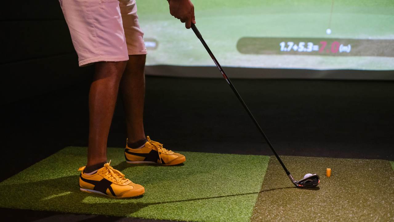 Person using a golf simulator